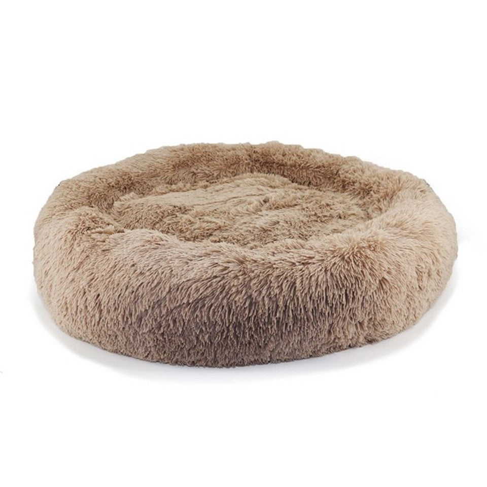 A soft donut bed for dogs in oatmeal 